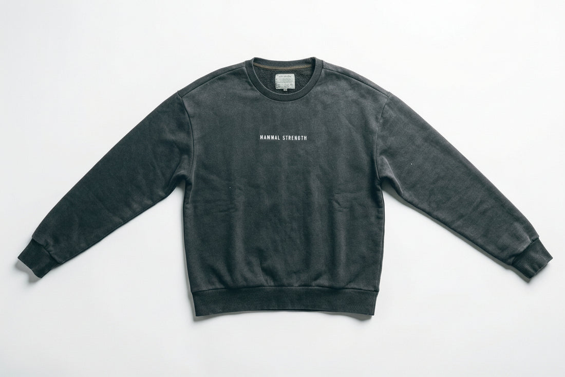 Mammal Strength black training sweatshirt flat lay on white background – premium gym and weightlifting apparel