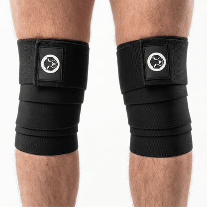 Mammal Strength black knee wraps worn on knees for powerlifting and squat support