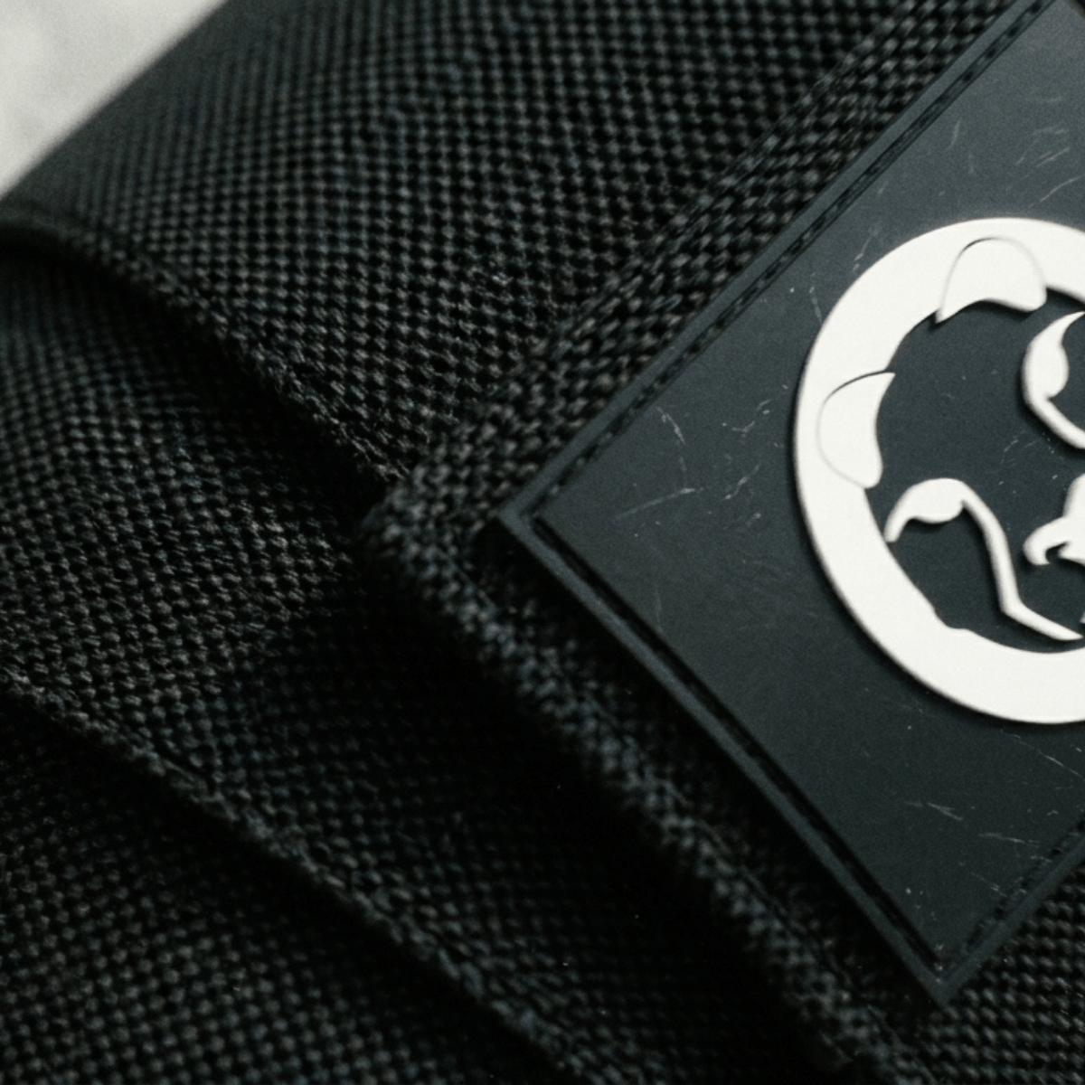 Mammal Strength knee wraps black fabric texture with logo patch detail