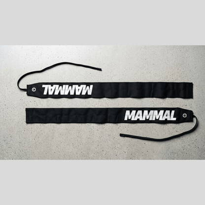 Mammal Strength lightweight wrist wraps laid flat showing full length and thumb loops